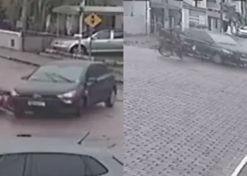 Motociclista colide com carro que entrava na via em Indaial; câmeras registraram o acidente
